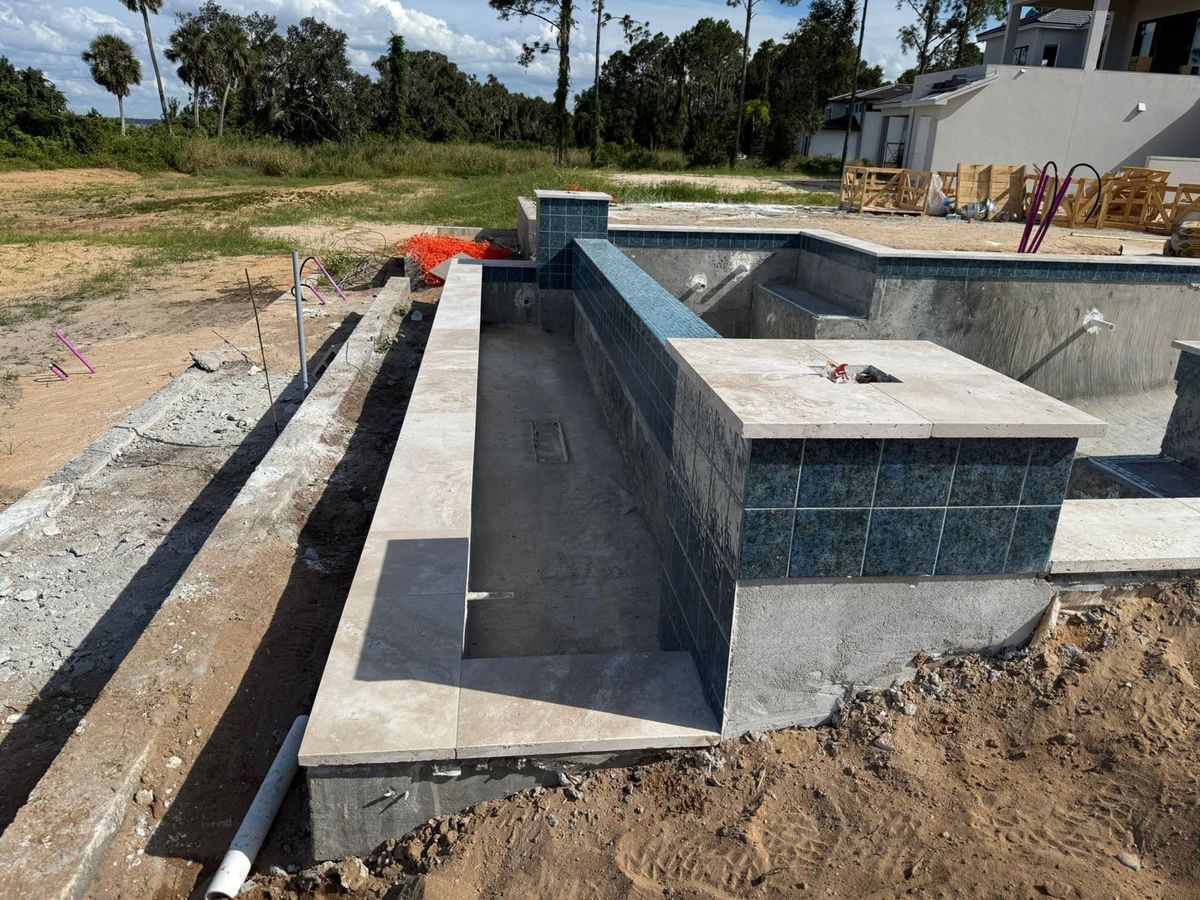 Travertine coping detail on spa